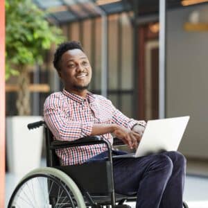 Disabled man using laptop